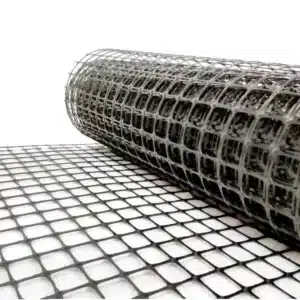 Close-up of plastic geogrid with square openings – locks soil particles in place to prevent sideways movement