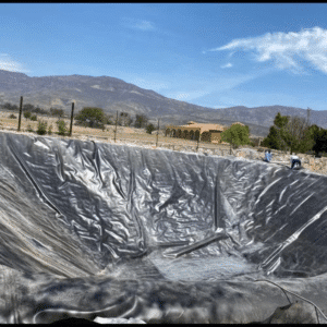 Heavy-Duty HDPE Geomembrane Installation on Gold Mining Heap Leach Pad